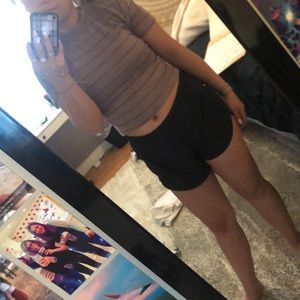 purple crop top with black horizontal stripes